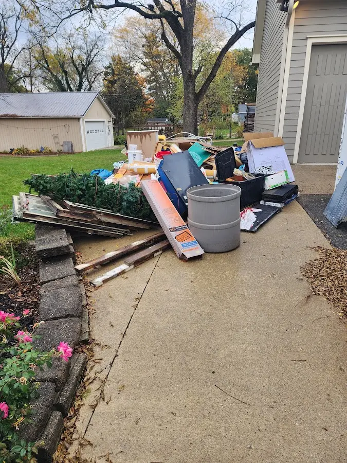 Dumpster being loaded with debris for 30 Yard Dumpster Rental in Lely Resort